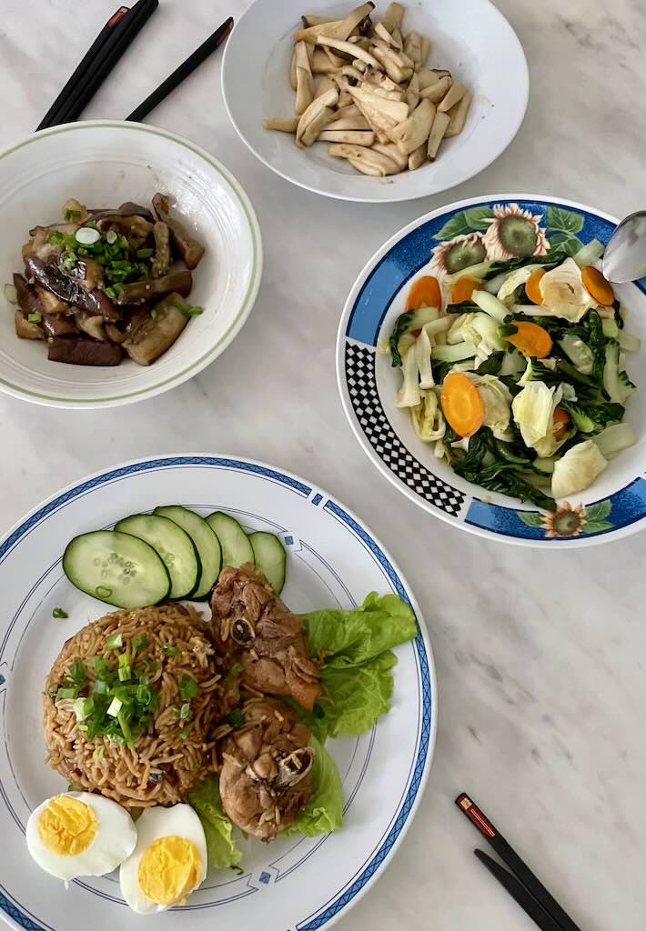 Claypot rice served with stir fried vegetables