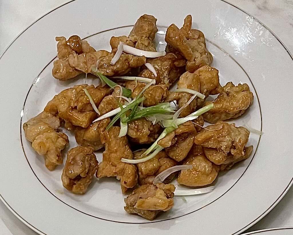 Sweet and sour chicken coated in sauce