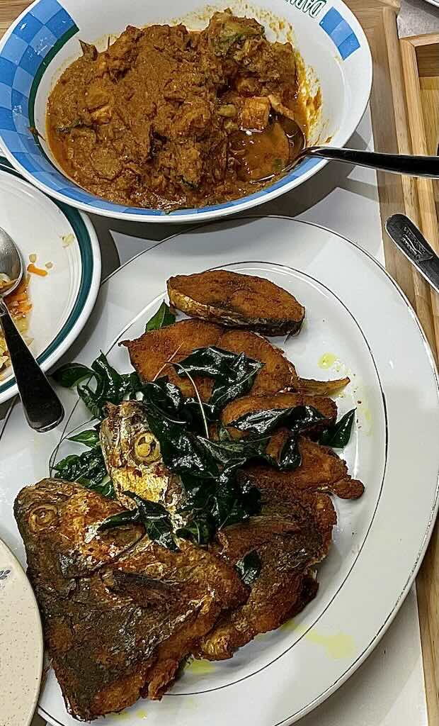 Turmeric fish served with rendang chicken