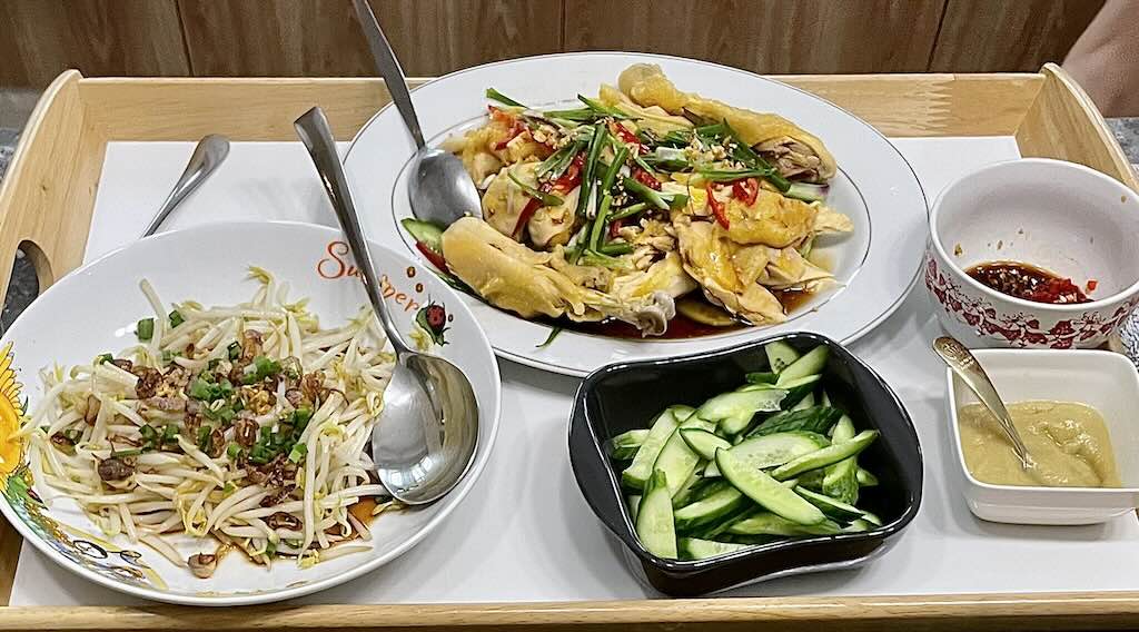 White cut chicken served with beansprouts,cucumber,ginger sauce