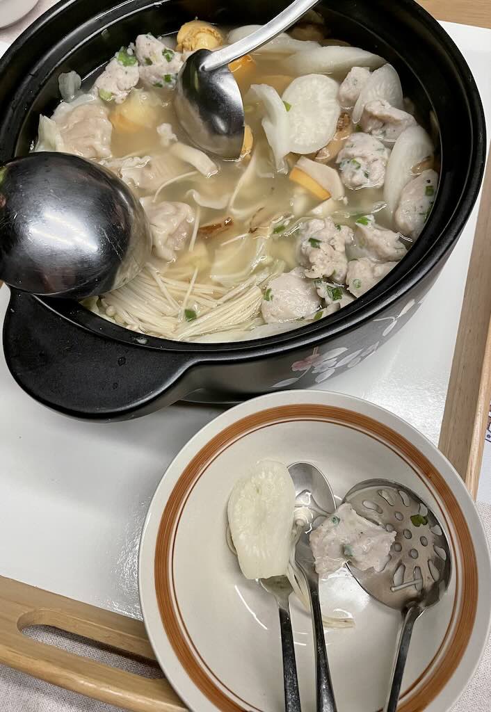 Yi Pin Guo soup with turnip,abalone,dumplings,enoki mushrooms,pork balls